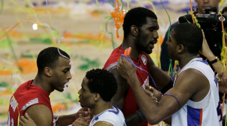 Ohio State guard Daequan Cook, left and teammate Greg Oden congratulate Florida's Taurean Green, second left and Al Horford following Florida's 84-75 victory in the Final Four basketball championship game at the Georgia Dome in Atlanta, Monday, April 2, 2007. (AP Photo/Morry Gash)
