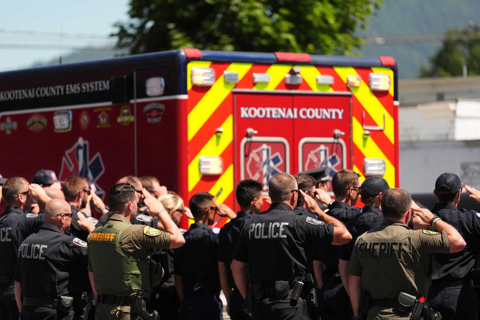 First responders honor the firefighters who were killed Sunday, in Coeur d'Alene, Idaho, on Tuesday, July 1, 2025. (AP Photo/Lindsey Wasson)