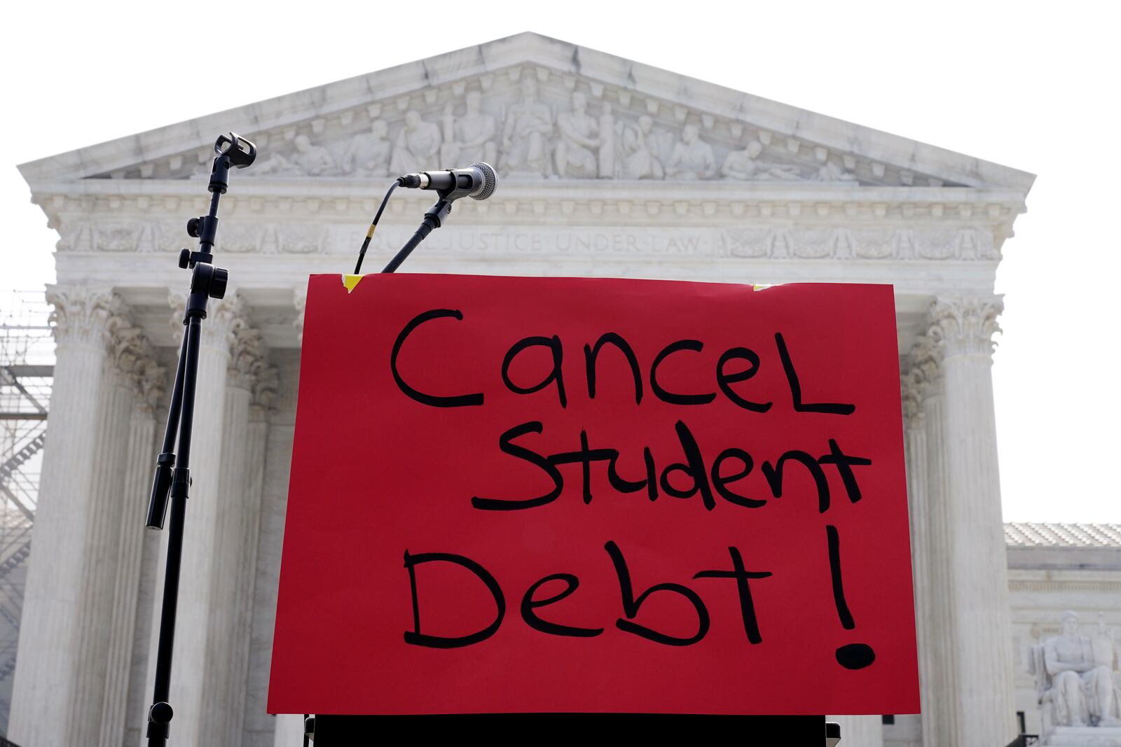 FILE - A sign reading "cancel student debt" is seen outside the Supreme Court, June 30, 2023, in Washington. (AP Photo/Mariam Zuhaib, File)