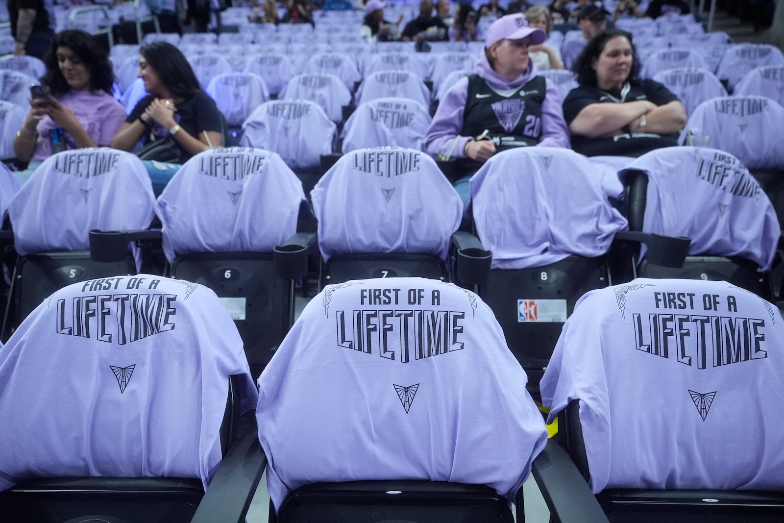 Golden State Valkyries t-shirts are placed on seats for fans at Chase Center before a WNBA basketball game between the Valkyries and the Los Angeles Sparks in San Francisco, Friday, May 16, 2025. (AP Photo/Jeff Chiu)