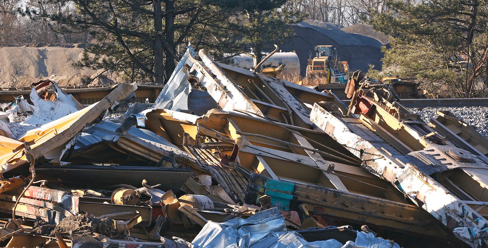 Work continues at the Norfolk Southern derailment site in Clark County as workers cut the remaining train cars into pieces to be hauled away Wednesday, March 15, 2023. BILL LACKEY/STAFF