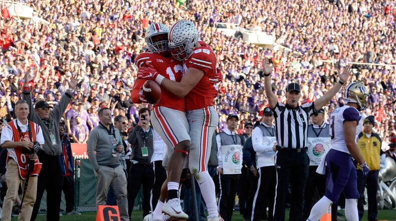 PASADENA, CA - JANUARY 01:  Rashod Berry #13 of the Ohio State Buckeyes and Luke Farrell #89 of the Ohio State Buckeyes celebrate after a touchdown during the first half in the Rose Bowl Game presented by Northwestern Mutual at the Rose Bowl on January 1, 2019 in Pasadena, California.  (Photo by Kevork Djansezian/Getty Images)