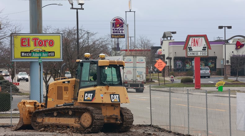 A bulldozer moves earth around at the site of the new City of Springfield Fire Station on South Limestone Street Friday, Jan. 20, 2023. BILL LACKEY/STAFF