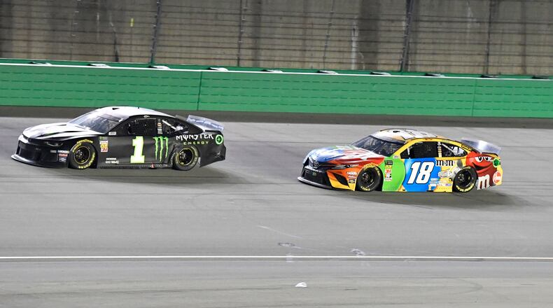 Kyle Busch (18) trails Kurt Busch (1) during the NASCAR Cup Series auto race at Kentucky Speedway in Sparta, Ky., Saturday, July 13, 2019. Kurt Busch won the race. (AP Photo/Timothy D. Easley)