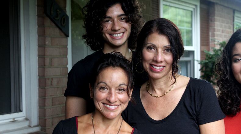 Adopted at birth, Lucianna Seed recently met family members she never knew she had, including Centerville's Raquel Rivera-Hill.    Max Seed is also pictured.