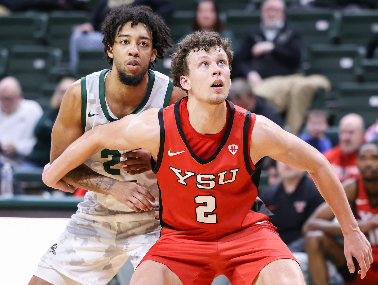 Youngstown State redshirt junior forward Rich Rolf, a Centerville native, boxes out Wright State's Logan Woods on a free-throw attempt during a Horizon League game on Thursday, Jan. 15 at Ervin J. Nutter Center in Fairborn. Rolf scored five points and had four rebounds in a 93-83 loss to the Raiders. BRYANT BILLING/STAFF