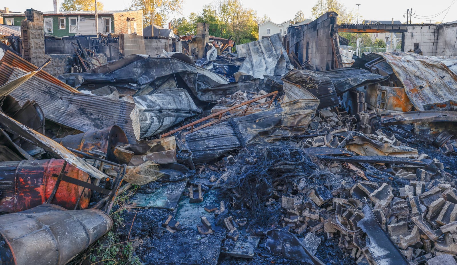 Buildings are severely damaged on Monday, November 4, 2025, following a fire on the 300 block of West Court Street in Urbana. JOSEPH COOKE/STAFF