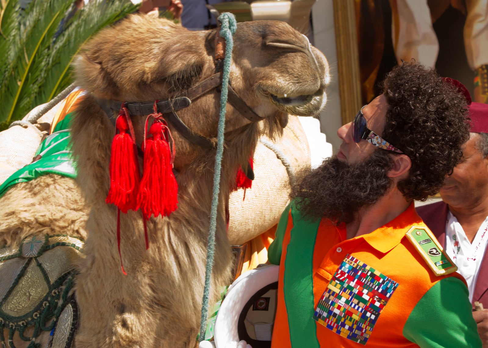 FILE - Actor Sacha Baron Cohen poses with a a camel during a photo call for The Dictator at the 65th international film festival, in Cannes, southern France, Wednesday, May 16, 2012. (AP Photo/Joel Ryan, File)