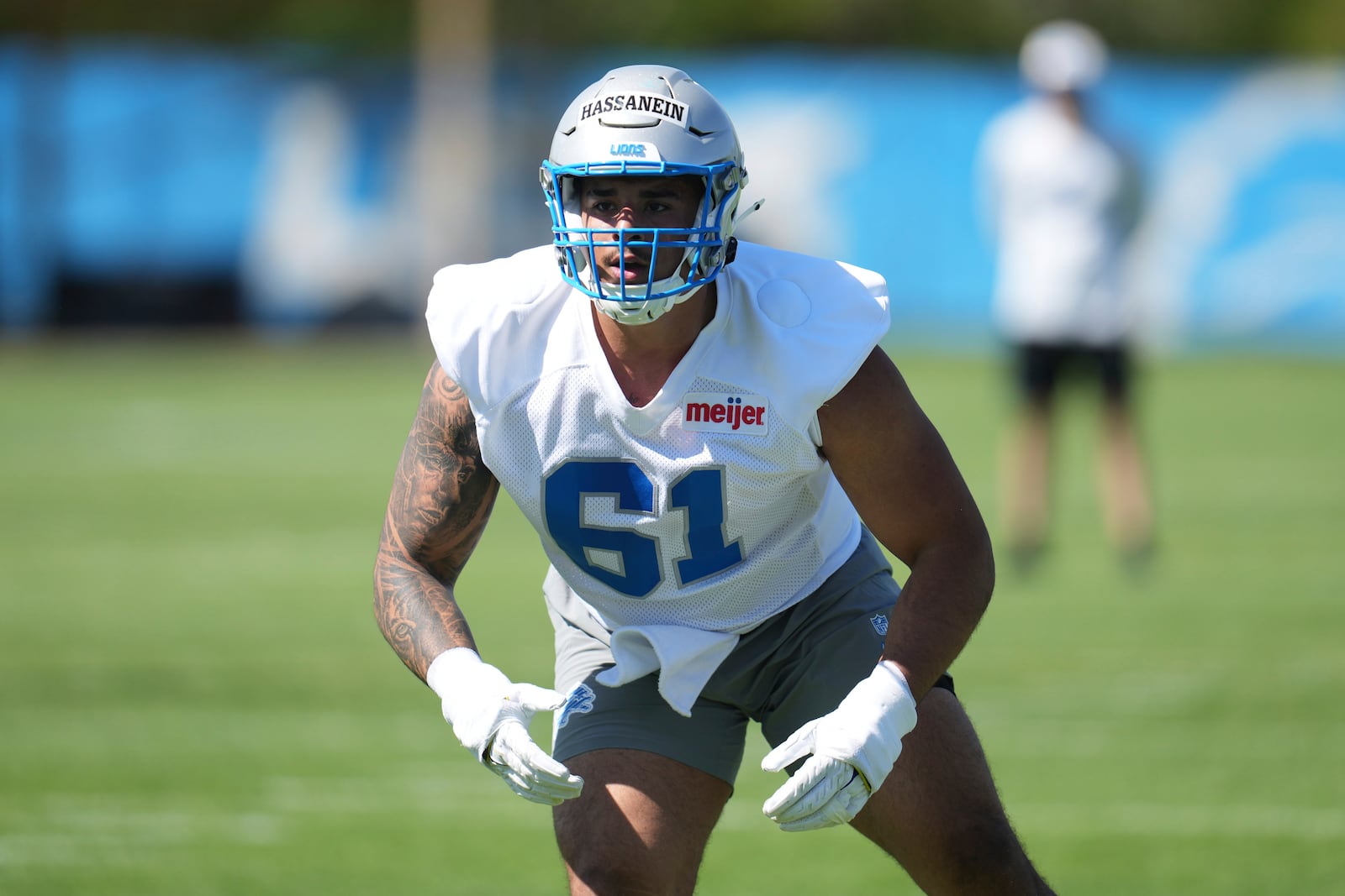 Detroit Lions defensive lineman Ahmed Hassanein (61) stretches during the NFL football team's rookie minicamp in Allen Park, Mich., Friday, May 9, 2025. (AP Photo/Paul Sancya)