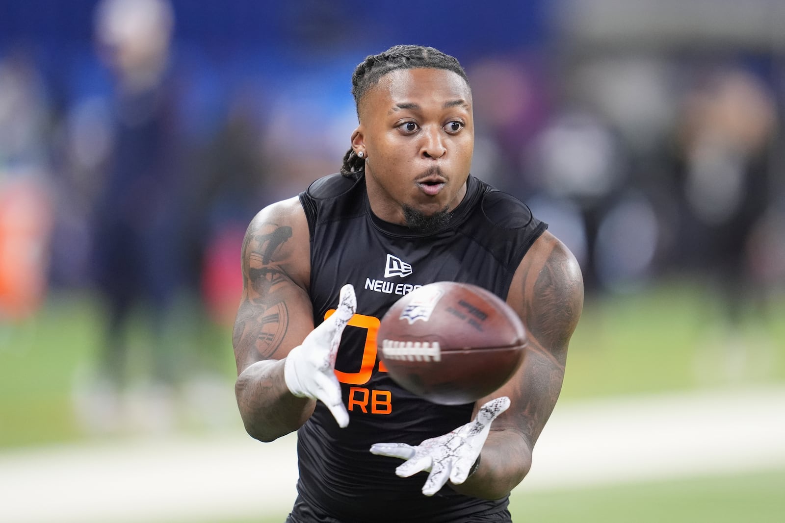 Texas Tech running back Tahj Brooks runs a drill at the NFL football scouting combine in Indianapolis, Saturday, Feb. 1, 2025. (AP Photo/Michael Conroy)