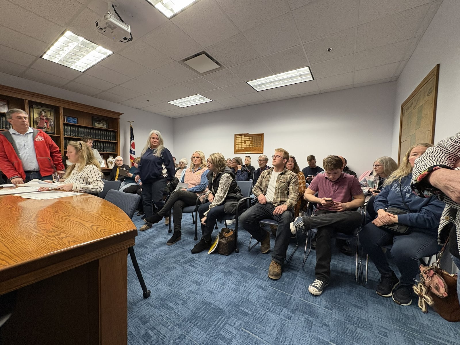 Champaign County Commissioners Nino Vitale (left) and Tim Cassady (right) during a Feb. 19 meeting with a room full of community members to talk about the potential data center. BROOKE SPURLOCK / STAFF