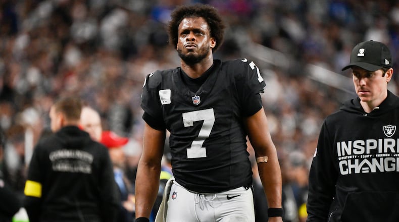 FILE - Las Vegas Raiders quarterback Geno Smith (7) leaves the field during the second half of an NFL football game against the New York Giants, Dec. 28, 2025, in Las Vegas. (AP Photo/David Becker, File)