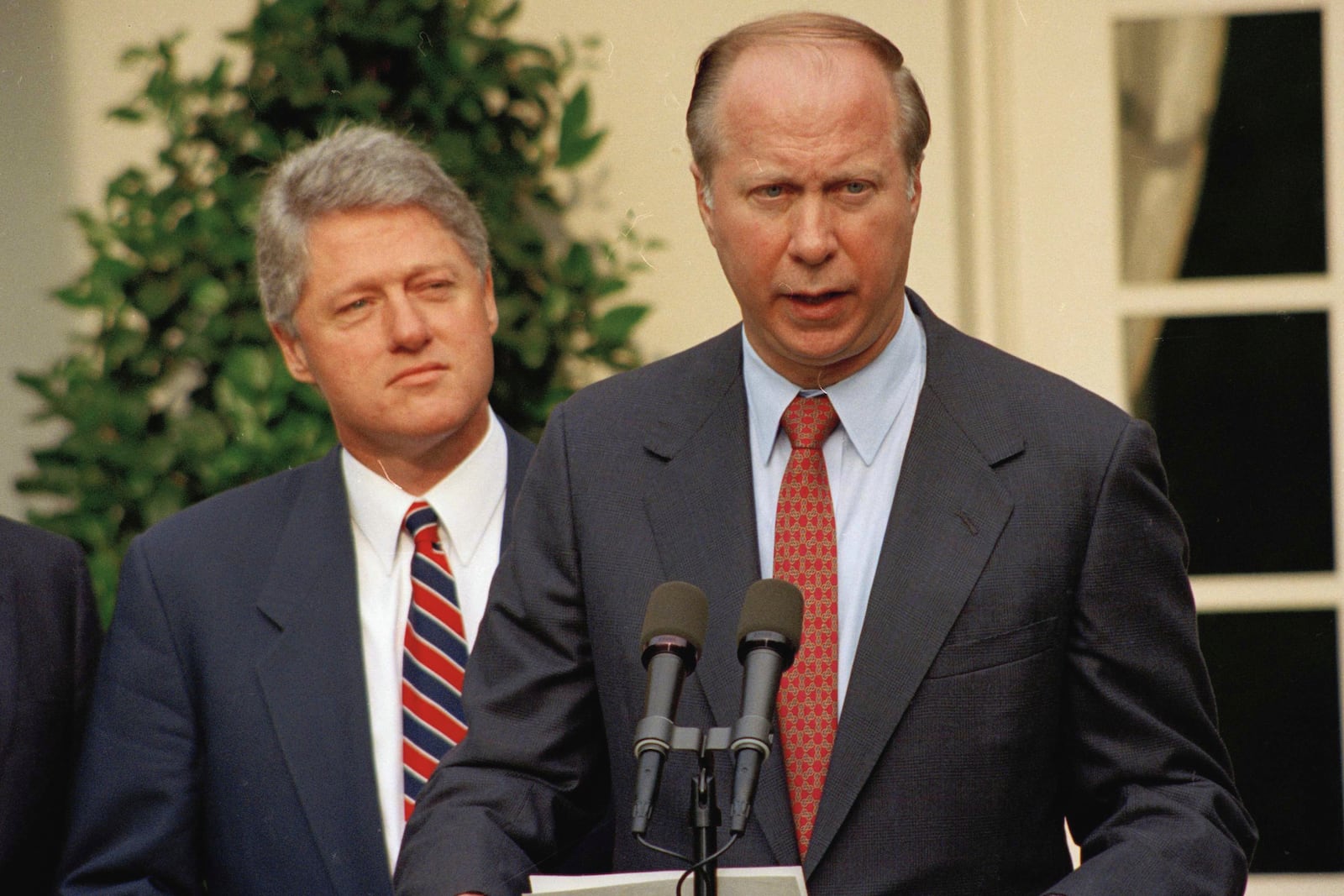 FILE - President Clinton listens to David Gergen during a Rose Garden news conference Saturday, May 29, 1993. (AP Photo/J. Scott Applewhite, File)