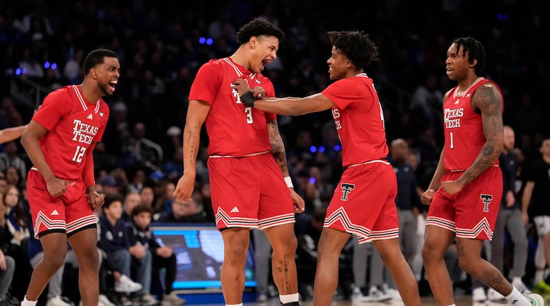 Texas Tech forward Lejuan Watts (3) celebrates with teammates after scoring during the first half of an NCAA college basketball game against Duke, Saturday, Dec. 20, 2025, in New York. (AP Photo/Yuki Iwamura)