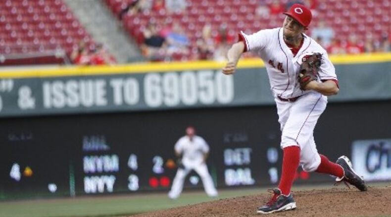Reds starter Mike Leake pitches against the Padres on Tuesday, May 13, 2014, at Great American Ball Park in Cincinnati. David Jablonski/Staff