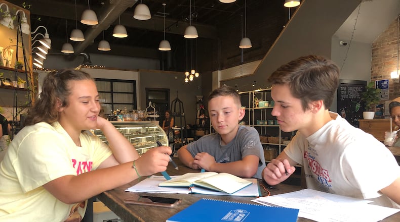 The student-led BATS, or Bringing Awareness to Students, service group is being revived to do community projects. The group is led by Addie Powell, left, Emerson Babian and Isaac Guest.