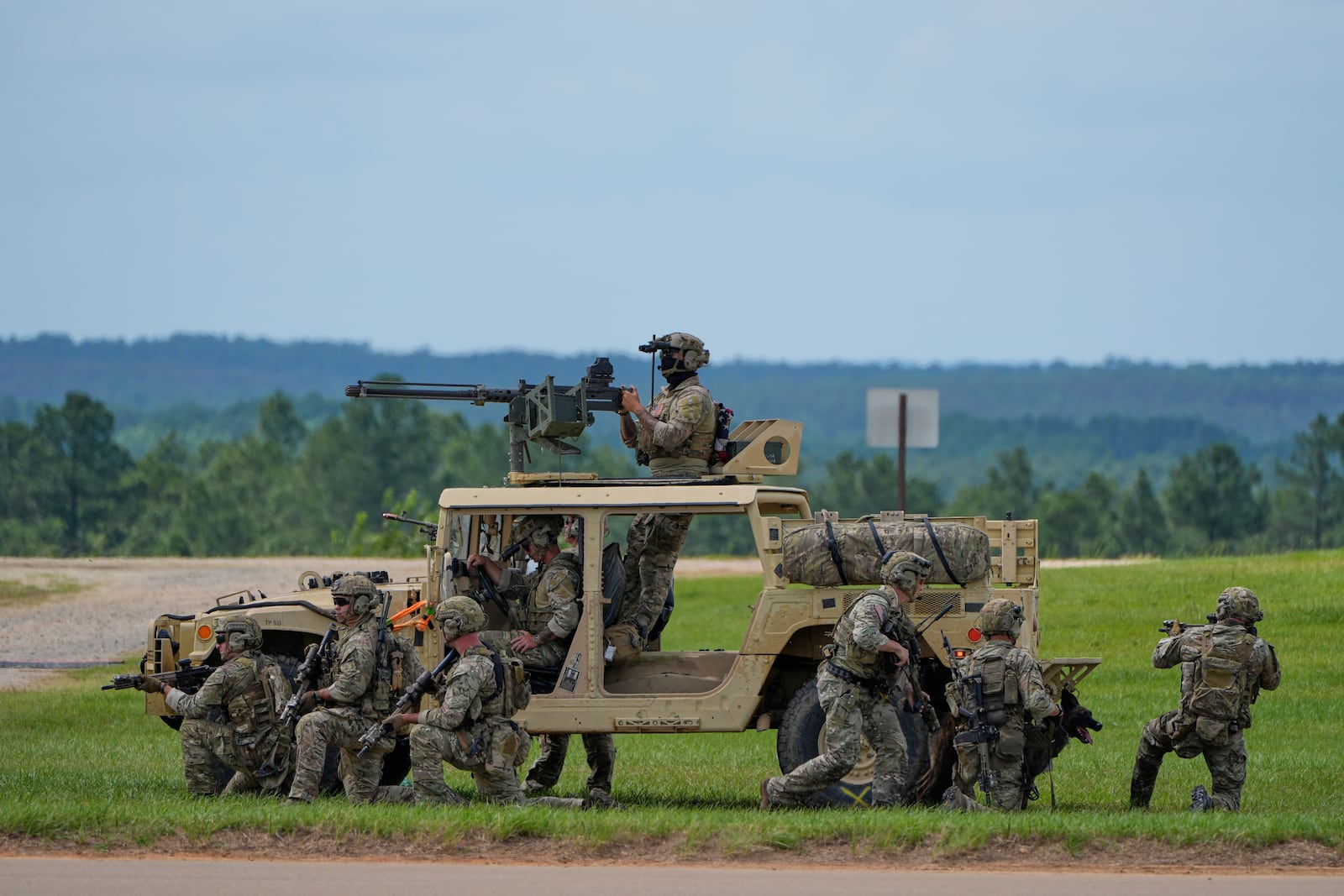 President Donald Trump observes a special operations command demonstration at Fort Bragg, Tuesday, June 10, 2025, in Fort Bragg, N.C. (AP Photo/Alex Brandon)