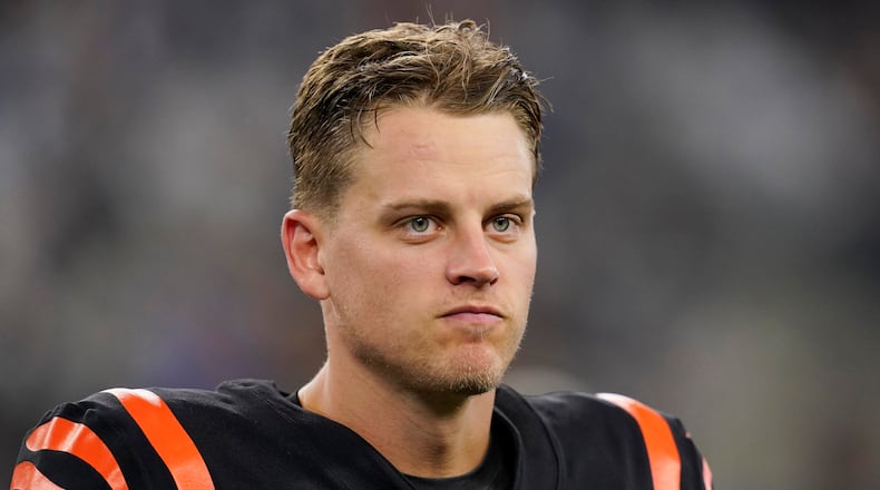 Cincinnati Bengals quarterback Joe Burrow (9) walks off the field after his 20-17 loss to the Dallas Cowboys after an NFL football game Sunday, Sept. 18, 2022, in Arlington, Tx. (AP Photo/Tony Gutierrez)