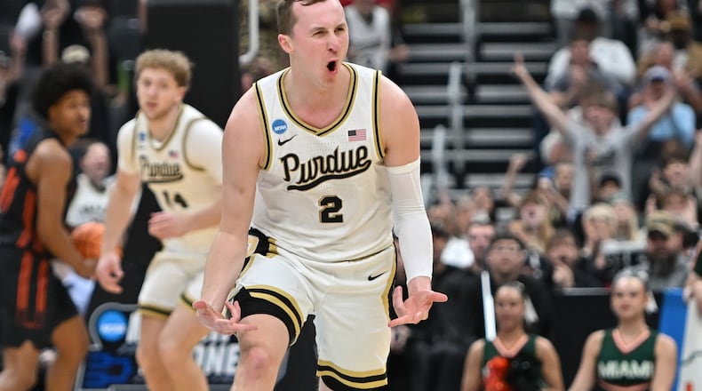 Purdue's Fletcher Loyer (2) celebrates during the first half in the second round of the NCAA college basketball tournament against Miami, Sunday, March 22, 2026, in St. Louis. (AP Photo/Ali Overstreet)