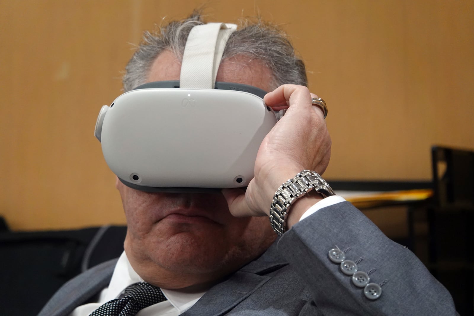 Miguel Rodriguez Albisu watches a virtual reality presentation Thursday, Dec. 17, 2024, at the Broward County Courthouse in Fort Lauderdale during a hearing on the admissibility of a virtual reality depiction in a stand-your-ground case. Albisu, 59, owner of a wedding venue in Southwest Ranches, is accused of pulling a gun on wedding guests who did not leave after he said they were supposed to. (Joe Cavaretta/South Florida Sun-Sentinel via AP)