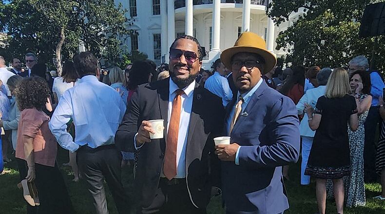 Dion Green, right, stands in front of the White House with Gregory Jackson Jr., a fellow survivor of gun violence, Monday, July 11, 2022. The president announced the signing of new bipartisan gun reform legislation. / CONTRIBUTED