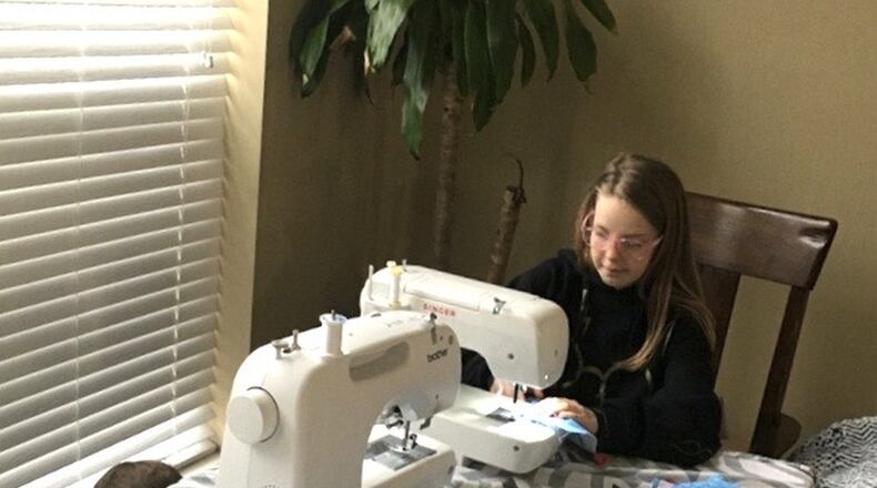 Abby Bean, 10, along with her friend Khloee Young, also 10, made masks for the Bethel Township Fire Department. CONTRIBUTED