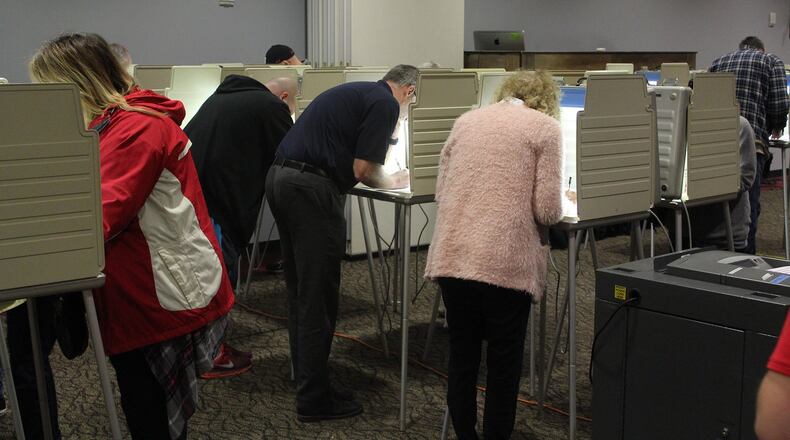 Voters cast their votes at the First Christian Church on Middle Urbana Road in 2018. Eric Higgenbotham/STAFF