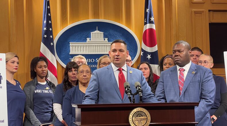 Ohio Rep. Haraz Ghanbari, R-Perrysburg, (front center), along with with Ohio Rep. Elgin Rogers, Jr. (D-Toledo, front right) and Ohio nurses pictured behind them, introducing proposed legislation that would implement nurse-to-patient ratios at Ohio hospitals. CONTRIBUTED