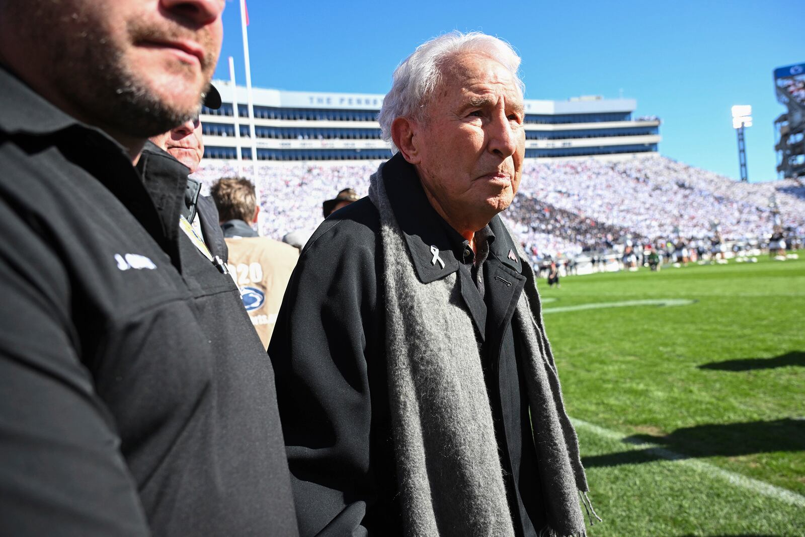FILE - ESPN College GameDay analyst Lee Corso leaves the field before an NCAA college football game between Penn State and Ohio State, in State College, Pa., Nov. 2, 2024. (AP Photo/Barry Reeger, File)