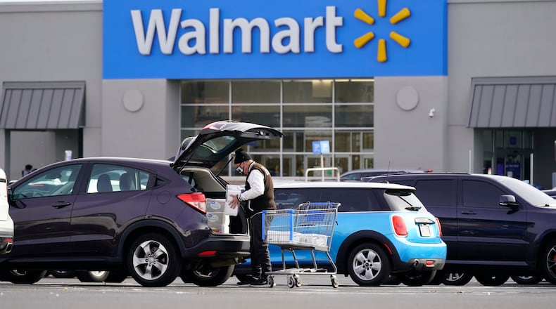 Walmart Plus members get free delivery on orders more than $55. AP FILE