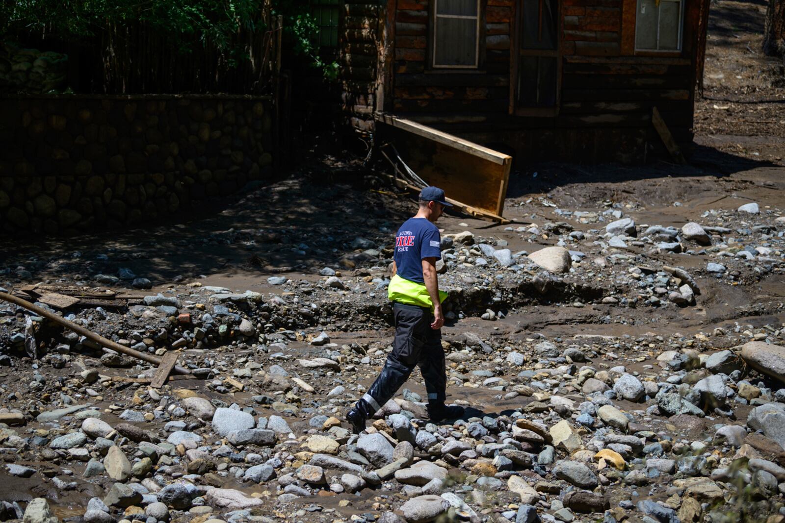 Ruidoso Fire Rescue members comb the Rio Ruidoso on Wednesday afternoon, July 9, 2025, in Ruidoso, N.M., looking for potential victims after flash floods hit the area yesterday. (AP Photo/Roberto E. Rosales)