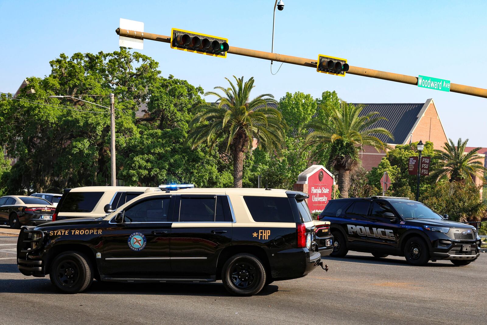 The Florida State Student Union building is seen behind law enforcement vehicles in Tallahassee, Fla., Thursday, April 17, 2025. (AP Photo/Gary McCullough)
