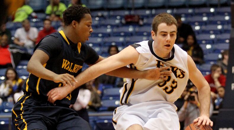 Centerville guard Eric Meininger is covered by Walnut Hills poing guard Sterling Gilmore during their Div. I district championship game at UD Arena in Dayton Saturday, Mar. 9, 2013. CONTRIBUTED PHOTO BY E.L. HUBBARD