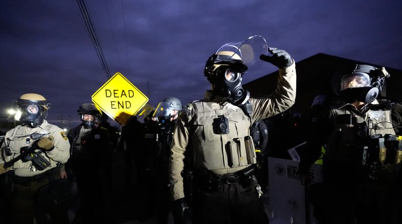 Law enforcement standoff with protesters outside an ICE processing facility in the Chicago suburb of Broadview, Ill., Saturday, Nov. 1, 2025. (AP Photo/Alex Brandon)