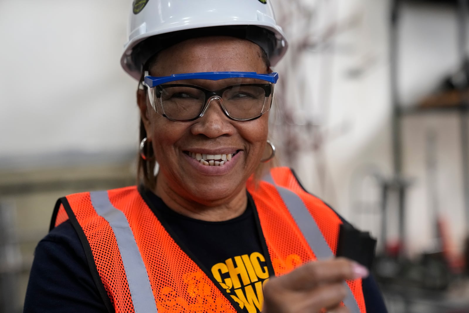 Instructor Kitty Thompson works with students during an Ironworkers Local 63 pre-apprenticeship class Wednesday, March 26, 2025, in Broadview, Ill. (AP Photo/Erin Hooley)