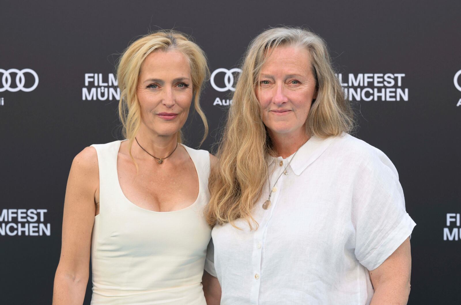 Actress Gillian Anderson, left, and author Raynor Winn pose ahead of the at the 42nd Munich Film Festival in Munich, Germany, July 1, 2025. (Felix Hörhager/dpa via AP)