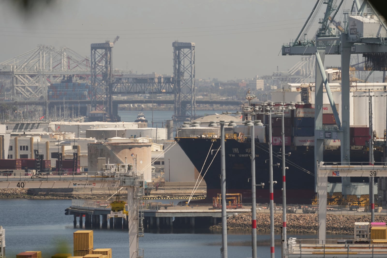 FILE - The YM Uniform container ship is docked at the Port of Los Angeles Wednesday, April 9, 2025, in Los Angeles. (AP Photo/Damian Dovarganes, File)