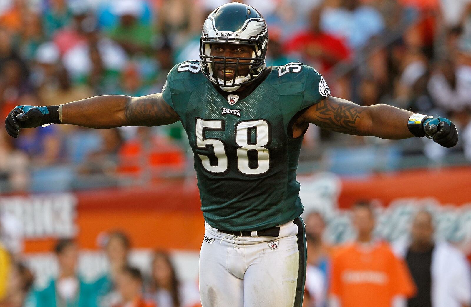 MIAMI GARDENS, FL - DECEMBER 11:   Trent Cole #58 of the Philadelphia Eagles celebrates a sack during a game against the Miami Dolphins at Sun Life Stadium on December 11, 2011 in Miami Gardens, Florida.  (Photo by Mike Ehrmann/Getty Images)