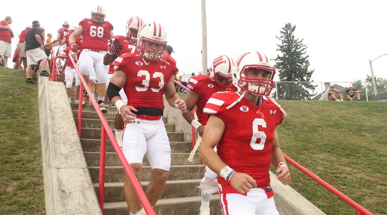 Wittenberg’s Jake Kennedy (6) and the Tigers walk to the field before a game against Wabash on Sept. 24, 2016, at Edwards-Maurer Field in Springfield. David Jablonski/Staff