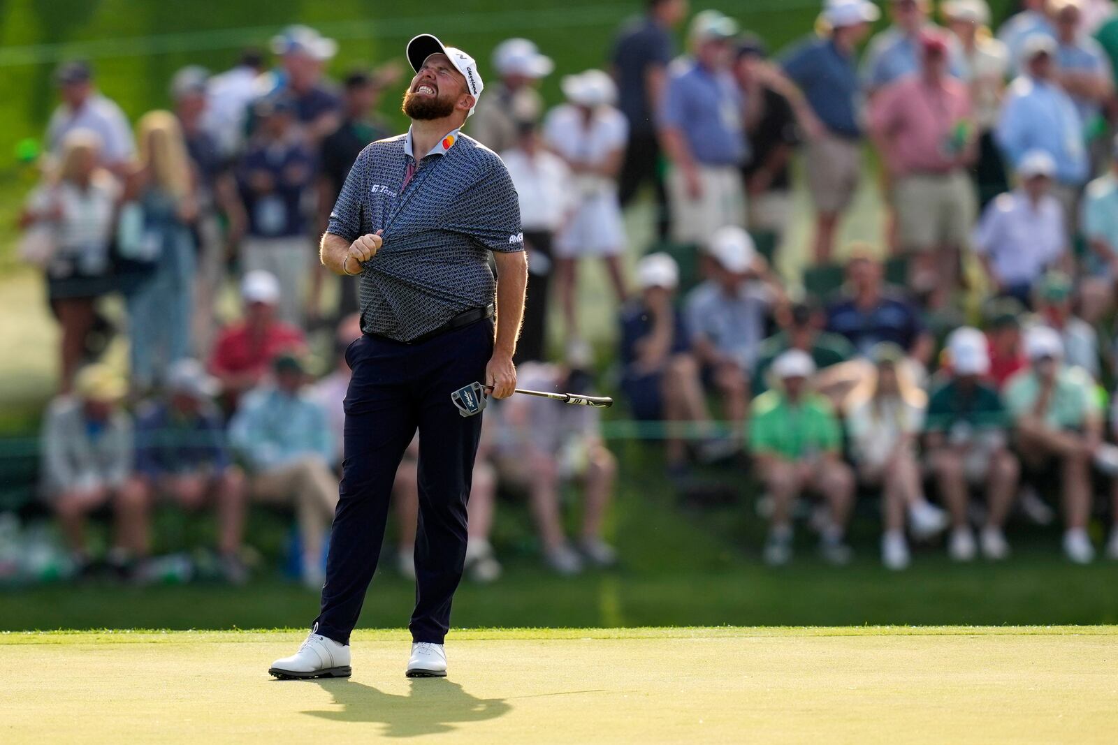 Shane Lowry, of Ireland, reacts after missing a putt on the 15th hole during the first round at the Masters golf tournament, Thursday, April 10, 2025, in Augusta, Ga. (AP Photo/David J. Phillip)