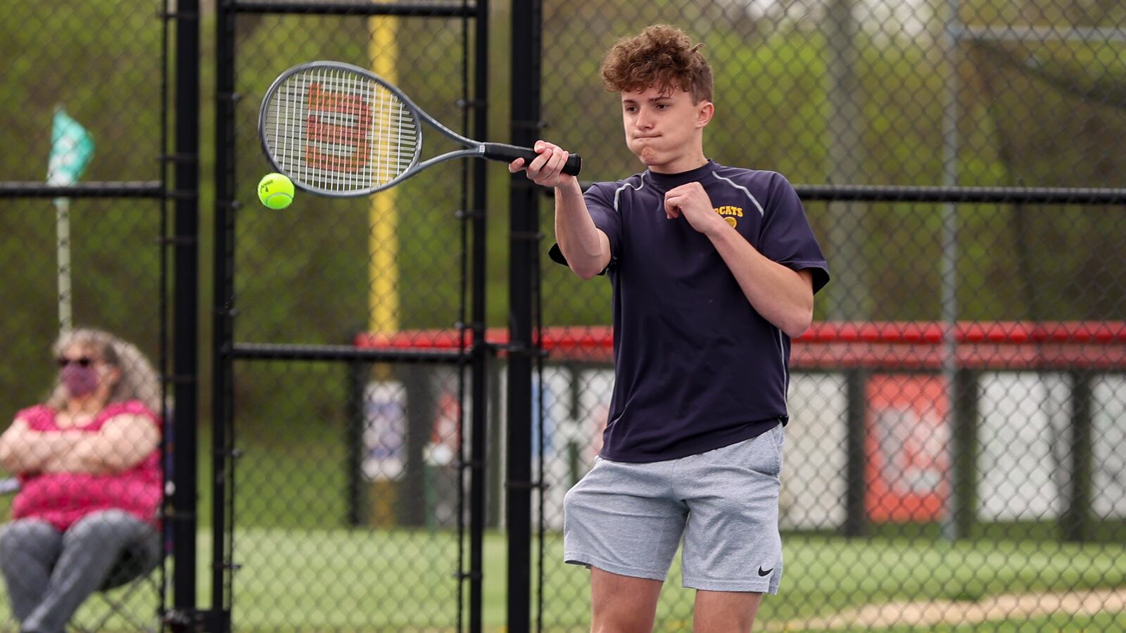 Springfield High School senior Rob Barnett hits the ball during the first doubles championship match on Saturday morning at Northwestern High School. Michael Cooper/CONTRIBUTED