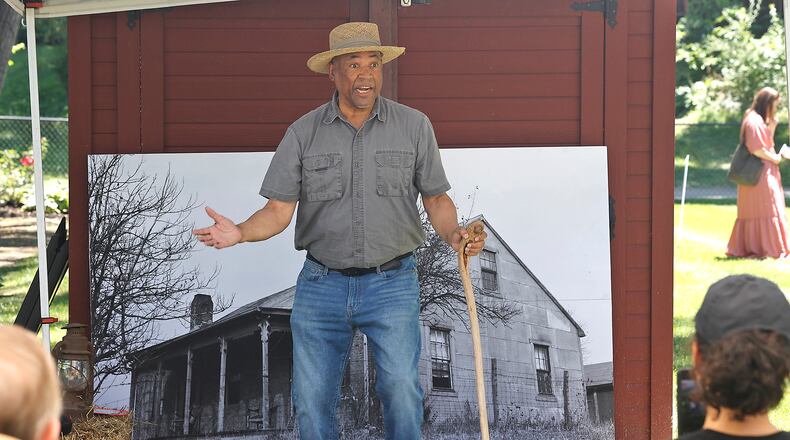 Reenactor John Hafford tells the story of Arnold Gragston, a conductor of the Underground Railroad, Saturday, June 15, 2024 during the Juneteenth and Fatherfest Celebration at the Gammon House in Springfield. BILL LACKEY/STAFF