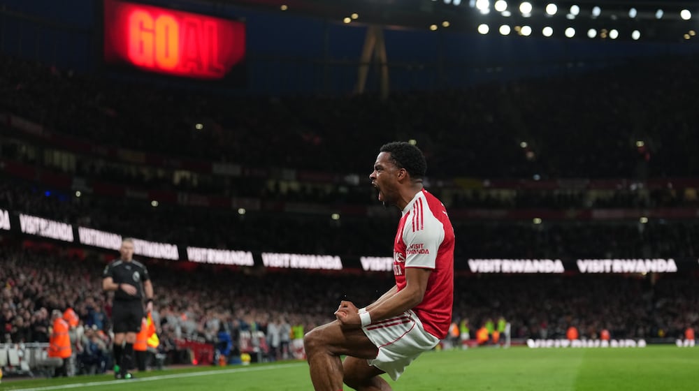Arsenal's Jurrien Timber celebrates after scoring during the Premier League soccer match between Chelsea Arsenal in London Sunday, March 1, 2026. (AP Photo/Alastair Grant)