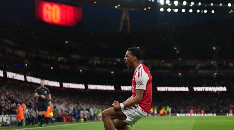 Arsenal's Jurrien Timber celebrates after scoring during the Premier League soccer match between Chelsea Arsenal in London Sunday, March 1, 2026. (AP Photo/Alastair Grant)
