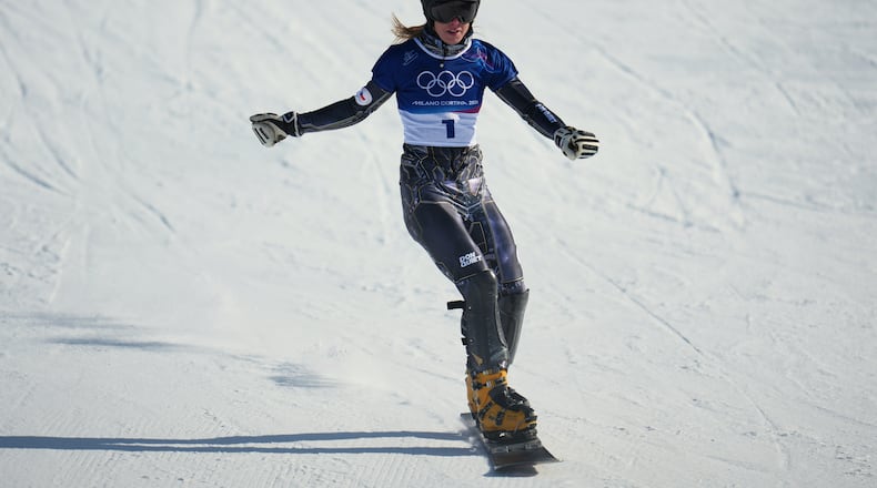 Czechia's Ester Ledecka reacts after finishing behind Austria's Sabine Payer during the women's snowboarding parallel giant slalom finals at the 2026 Winter Olympics, in Livigno, Italy, Sunday, Feb. 8, 2026. (AP Photo/Abbie Parr)