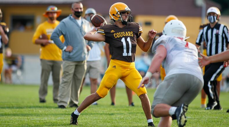 Kenton Ridge High School junior quarterback Ethan Moore throws the ball during their scrimmage against Carlisle on Friday, Aug. 21, 2020 at Richard L. Phillips Stadium in Springfield. CONTRIBUTED PHOTO BY MICHAEL COOPER