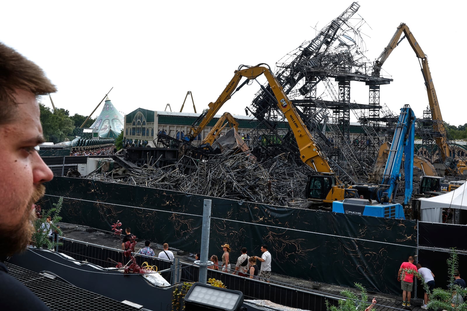 The burned main stage is seen at the Tomorrowland music festival in Boom, Belgium, Friday, July 18, 2025, two days after a huge fire destroyed the stage on Wednesday. (AP Photo/Omar Havana)