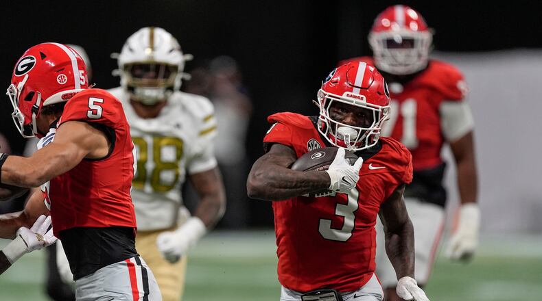Georgia running back Nate Frazier (3) runs against Georgia Tech during the first half of an NCAA college football game, Friday, Nov. 28, 2025, in Atlanta. (AP Photo/Mike Stewart)