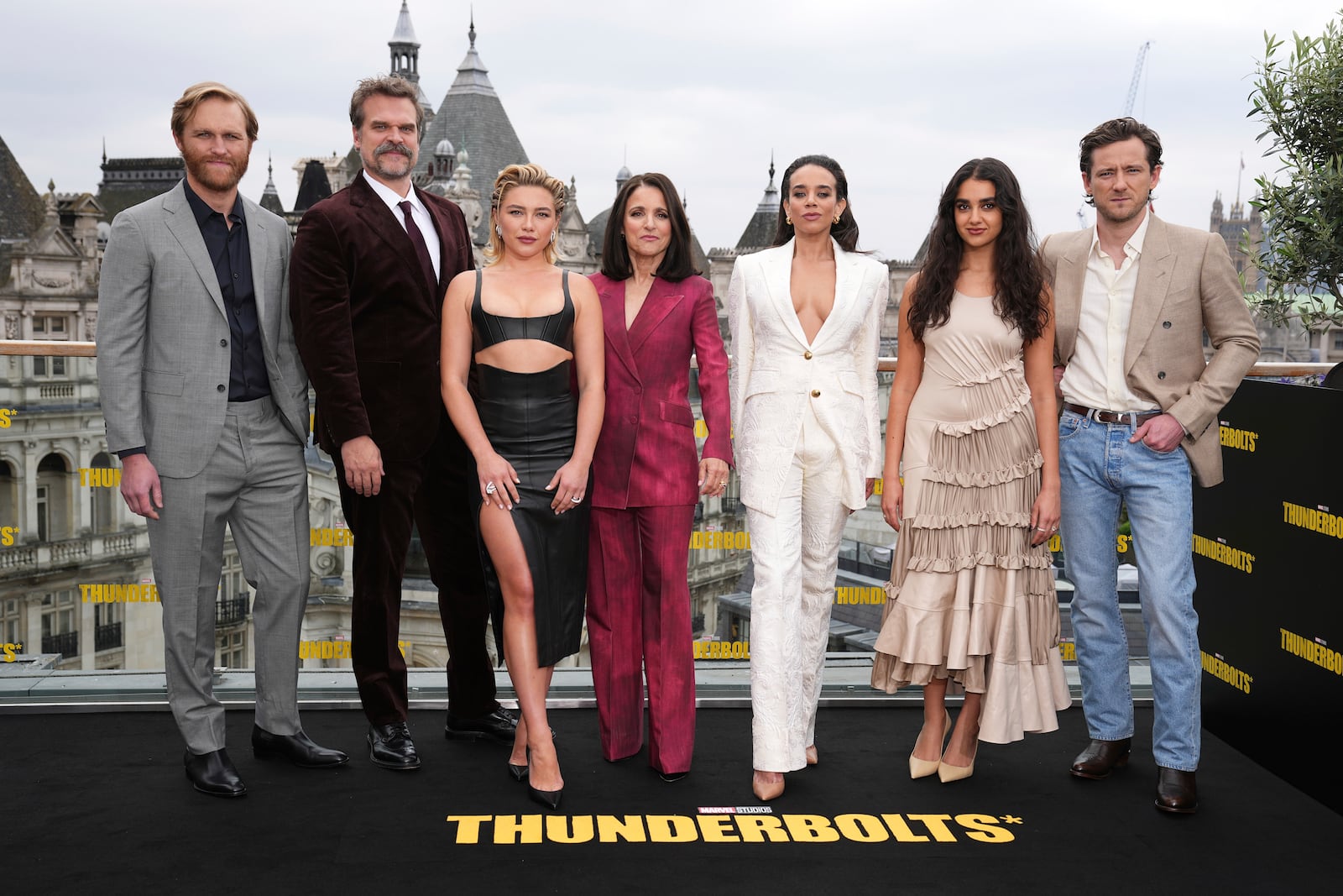 Wyatt Russell, from left, David Harbour, Florence Pugh, Julia Louis-Dreyfus, Hannah John-Kamen, Geraldine Viswanathan and Lewis Pullman pose for photographers at the photo call for the film 'Thunderbolts' on Thursday, April 24, 2025, in London. (Photo by Scott A Garfitt/Invision/AP)