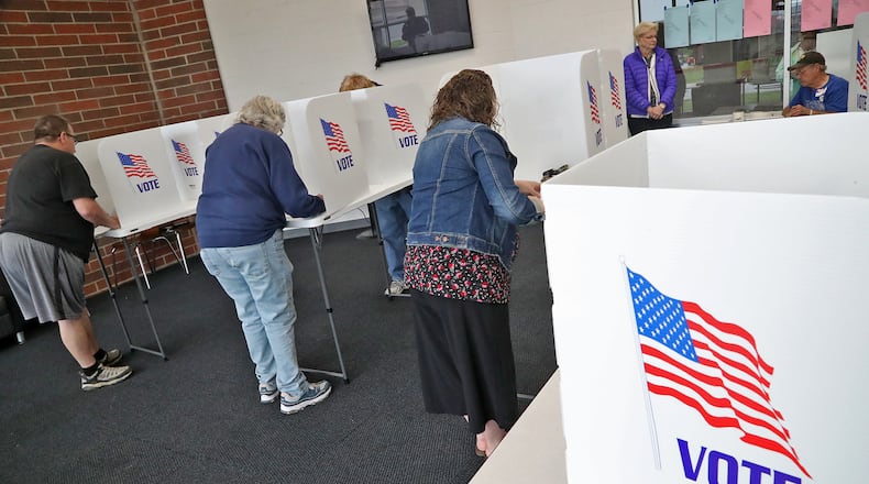 Voters cast their votes at a Springfield election poll Tuesday, May 3, 2022. BILL LACKEY/STAFF